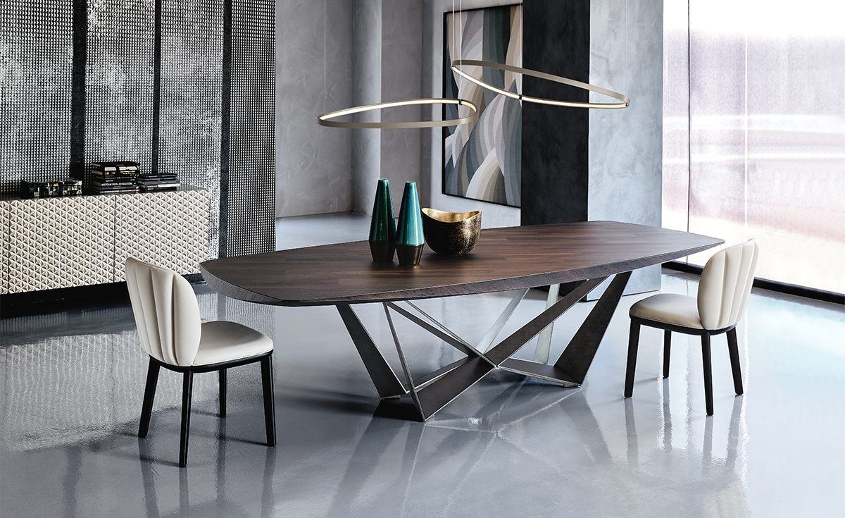 Skorpio Wood table design haut de gamme et acier laqué par Cattelan Italia, alliance parfaite entre force sculpturale et élégance naturelle. Disponible chez D-Style Interior.