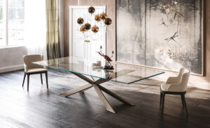Spyder table design en verre avec base en bois sculpté signée Cattelan Italia, un équilibre parfait entre légèreté et élégance. Disponible chez D-Style Interior.