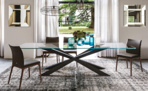 Spyder table design en verre avec base en bois sculpté signée Cattelan Italia, un équilibre parfait entre légèreté et élégance. Disponible chez D-Style Interior.