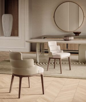 Fauteuil Audrey de Vittoria Frigerio – un design sculptural aux lignes arrondies et à la base en frêne massif, symbole d’un confort raffiné et d’un luxe discret. Disponible chez D-Style Interior.