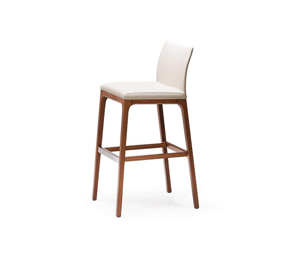 Arcadia Tabouret au design minimaliste, assise rembourrée et structure bois raffinée. Disponible chez D-Style Interior.