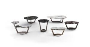 Savini table basse associe une base trapézoïdale en bois massif à un plateau en marbre assorti. Design sculptural et luxueux. Disponible chez D-Style Interior.