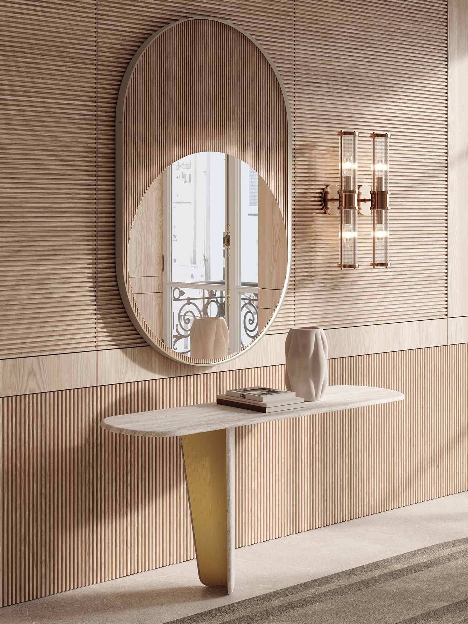 Monroy Console en marbre avec insert métallique contrasté, silhouette asymétrique et fixation murale. Disponible chez D-Style Interior.