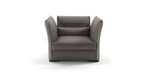Clivio fauteuil design haut de gamme par Vittoria Frigerio, avec matelassage raffiné, boutons dorés et zip décoratif. Disponible chez D-Style Interior.