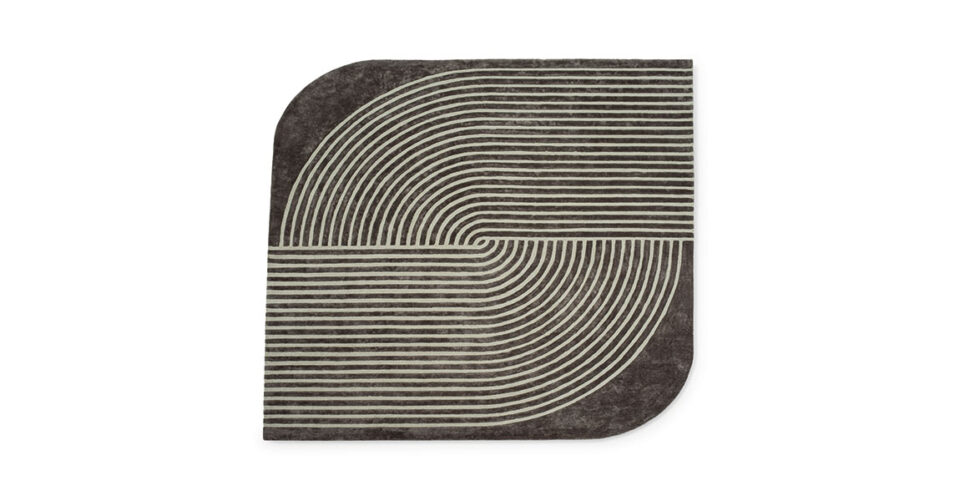 Cusani tapis de Vittoria Frigerio associe lignes précises et courbes élégantes dans un tapis haut de gamme en Tencel. Disponible chez D-Style Interior.