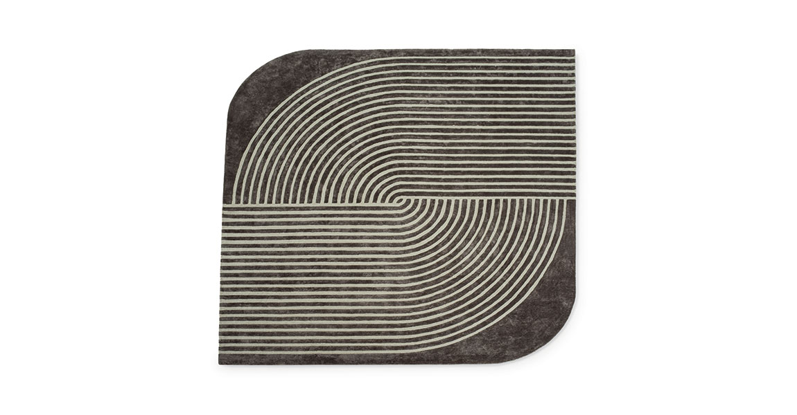 Cusani tapis de Vittoria Frigerio associe lignes précises et courbes élégantes dans un tapis haut de gamme en Tencel. Disponible chez D-Style Interior.