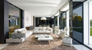 Gloss fauteuil design haut de gamme par Gamma Arredamenti avec détails raffinés, assise moelleuse et base métallique élégante. Disponible chez D-Style Interior.