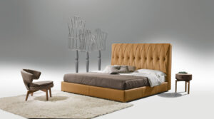 Lolita fauteuil moderne en cuir, compact et élégant, avec base en bois ou métal et assise enveloppante. Disponible chez D-Style Interior.