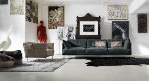 Trench fauteuil de Gamma Arredamenti, cuir moderne avec détails sophistiqués et pochette magazine pratique. Disponible chez D-Style Interior.