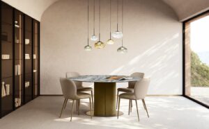 Milos table à manger de Gamma Arredamenti associe cuir, bois courbé et plateau en marbre, verre ou céramique. Élégance italienne disponible chez D-Style Interior.